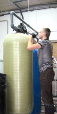 Water filtration system installation by Pro Filtration technician in Orange County