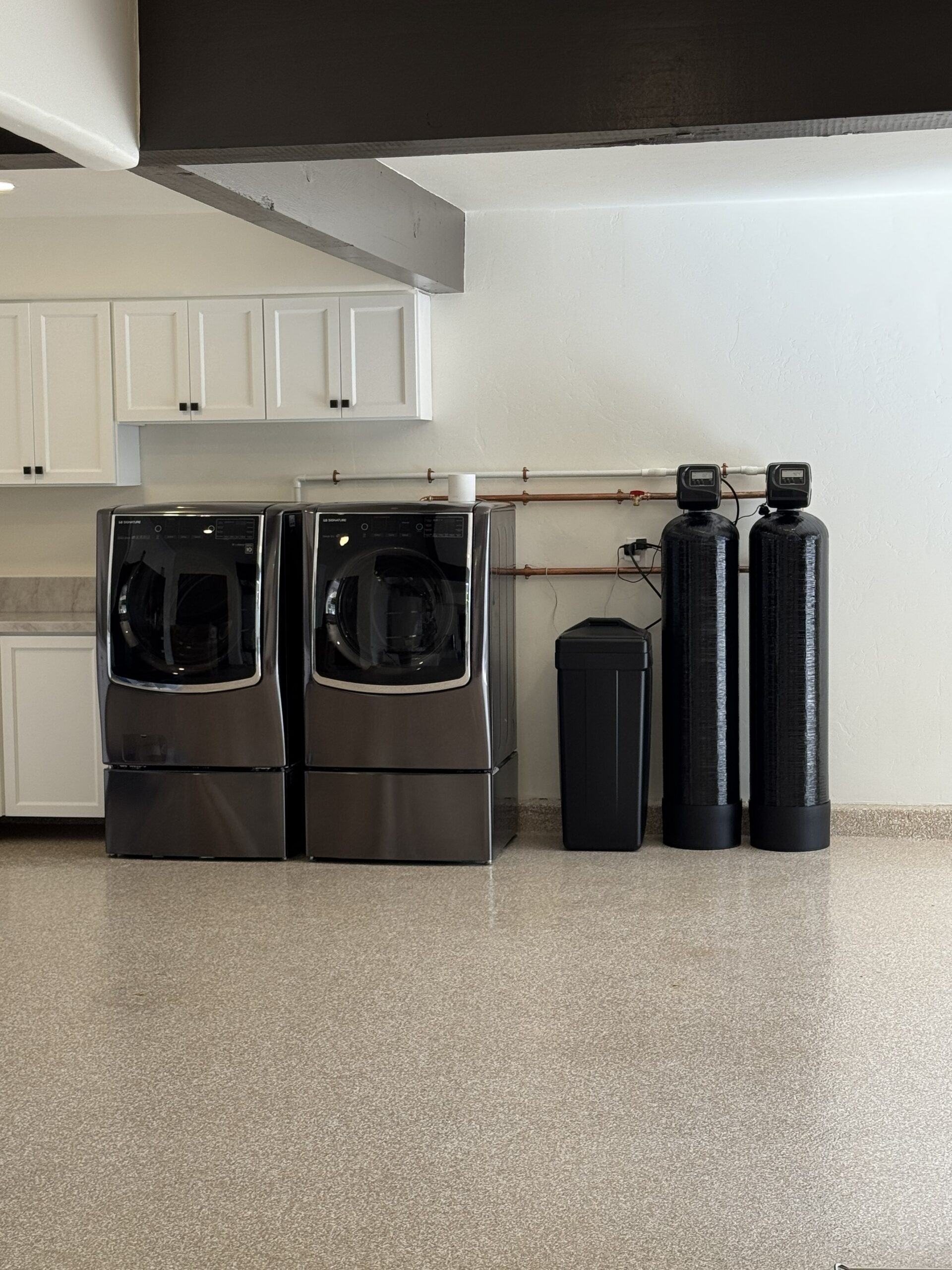 Catalytic carbon whole-house filter and salt-based water softener installed in a San Clemente garage