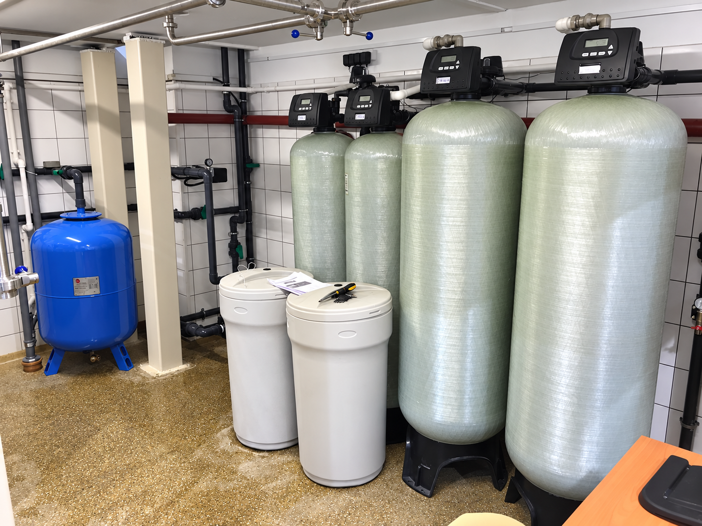 Brewery water treatment system configured for continuous aeration, iron removal, and softening.